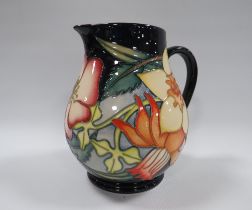 A MOORCROFT DAFFODIL PATTERNED WATER JUG, impressed, and painted marks to base, dated 2001 with E.