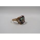 A HALLMARKED 9CT GOLD MYSTIC TOPAZ DRESS RING, the circular cushion effect stone with all over