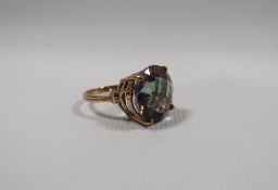 A HALLMARKED 9CT GOLD MYSTIC TOPAZ DRESS RING, the circular cushion effect stone with all over