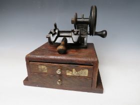 A PORTABLE ANTIQUE YALE No. M1005 KEY CUTTING MACHINE, set of two drawer base, complete with keys