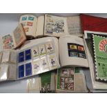 A COLLECTION OF THREE ALBUMS AND LOOSE WORLD & BRITISH STAMPS & FIRST DAY ISSUES, to include two