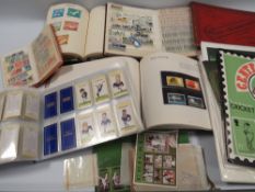 A COLLECTION OF THREE ALBUMS AND LOOSE WORLD & BRITISH STAMPS & FIRST DAY ISSUES, to include two