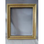 A LATE 19TH / EARLY 20TH CENTURY GOLD FRAME, with design to inner edge, frame W 9 cm, rebate 79 x 63