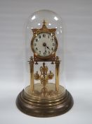 AN EARLY 20TH CENTURY TORSION CLOCK, complete with ball carriage pendulum, under glass dome, H 30