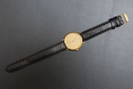 LONGINES - A HALLMARKED 9 CARAT GOLD WRIST WATCH, on leather strap and cabochon set winder, in