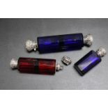 A COLLECTION OF THREE SCENT BOTTLES, two being double ended examples in both blue and red glass, the