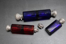 A COLLECTION OF THREE SCENT BOTTLES, two being double ended examples in both blue and red glass, the