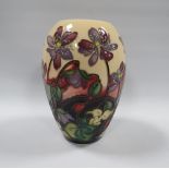 A 2011 MOORCROFT HEPATICA PATTERN VASE DESIGNED AND SIGNED BY EMMA BOSSUNS, printed and painted