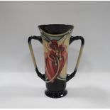 A MOORCROFT 'BLEEDING HEART' PATTERN TWIN HANDLED VASE, with Art Nouveau styling, designed by