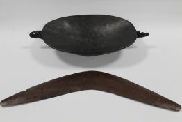 A 19TH CENTURY AUSTRALIAN ABORIGINAL CARVED BOOMERANG, together with a Papua New Guinea Ramu river