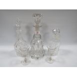 A GEORGIAN GLASS DECANTER TOGETHER WITH LATER EXAMPLES, also with two antique glasses (5)