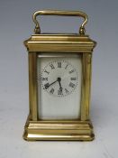 A MODERN FIVE GLASS BRASS CASED MINIATURE CARRIAGE CLOCK, the enamel dial with Roman numerals,