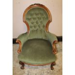 A VICTORIAN MAHOGANY SPOONBACK GENTLEMANS ARMCHAIR, with carved detail