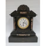 A LARGE BLACK SLATE MANTLE CLOCK WITH VARIEGATED MARBLE EMBELLISHMENT, having a single train