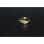 AN 18CT & PLAT DIAMOND RING, in a split band setting with an approx 10 points of diamonds, approx