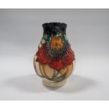 A SMALLER MOORCROFT ANNA LILY PATTERN VASE, of bulbous form, with impressed and painted marks to