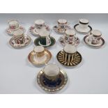 A COLLECTION OF ELEVEN ROYAL WORCESTER COFFEE CANS AND SAUCERS, to include a selection reproduced