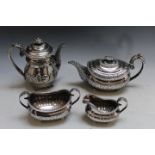 A MATCHED HALLMARKED SILVER FOUR PIECE TEA AND COFFEE SERVICE, hallmarks very rubbed, some pieces by