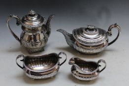 A MATCHED HALLMARKED SILVER FOUR PIECE TEA AND COFFEE SERVICE, hallmarks very rubbed, some pieces by