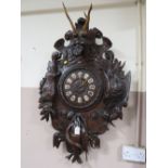 A VERY LARGE 19TH CENTURY BLACK FOREST HUNTING THEMED WALL CLOCK, the heavily carved case displaying