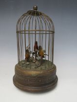 AN EARLY 20TH CENTURY MUSICAL / AUTOMATON BIRD CAGE, with three birds on a naturalistic setting, H 2