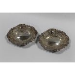 A PAIR OF HALLMARKED SILVER PIERCED BON BON DISHES BY ROBERTS & DORE LTD - LONDON 1969, approx