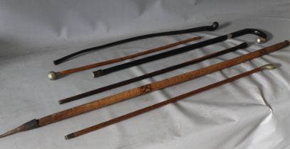 AN EBONISED WALKING STICK WITH SILVER MOUNTED AND TWO MILITARY SWAGGER STICKS / CANES, together with