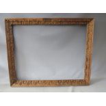 A LATE 18TH / EARLY 19TH CENTURY CARVED WOODEN DECORATIVE FRAME, frame W 6 cm, rebate 98 x 77 cm