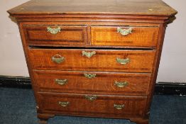 A 19TH CENTURY OAK CHEST OF FIVE DRAWERS, each drawer with crossbanded mahogany detailing, raised on