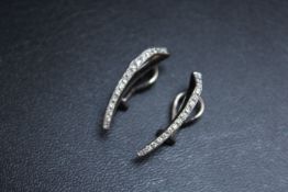 A PAIR OF DIAMOND SET EARRINGS, set in white metal stamped 750, clip on fastening, approx combined