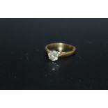 A HALLMARKED 18 CARAT GOLD DIAMOND SOLITAIRE RING, the diamond being of an estimated three