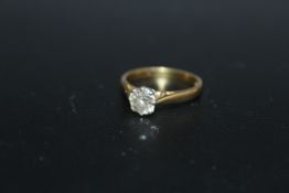 A HALLMARKED 18 CARAT GOLD DIAMOND SOLITAIRE RING, the diamond being of an estimated three