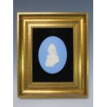 A WEDGWOOD JASPERWARE OVAL PLAQUE DEPICTING ADMIRAL LORD NELSON, framed 12 x 9 cm