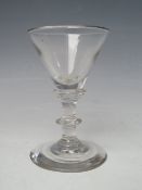 AN 18TH CENTURY WINE GLASS, with conical shaped bowl, three ring annulated knop stem with single
