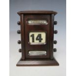 AN EARLY PERPETUAL DESK CALENDAR, with apertures for day, date and month, H 17 cm