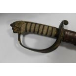 A 19TH CENTURY NAVAL CEREMONIAL SWORD IN LEATHER SCABBARD, the blade with engraved detail, L 96 cm