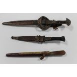 THREE ANTIQUE NORTH WEST AFRICAN TRIBAL ART DAGGERS AND KNIVES WITH SHEATHS