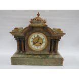 A GREEN VARIEGATED ONYX CASED MANTLE CLOCK OF ARCHITECTURAL FORM, having various gilded brass