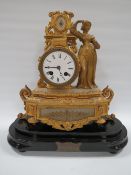 A LATE 19TH CENTURY GILDED SPELTER FEMALE FIGURAL CLOCK. with ornate drum head case having alabaster
