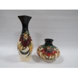 TWO MOORCROFT 'ANNA LILY' PATTERN VASES, comprising a slender vase with squared rim, H 21 cm, and