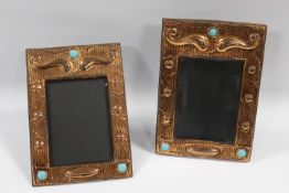 A PAIR OF ARTS AND CRAFTS STYLE COPPER PHOTOGRAPH FRAMES, rectangular from, each with stylised