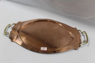 AN ART NOUVEAU OVAL COPPER TRAY, with twin handles, hammered finish, W 60.5 cm