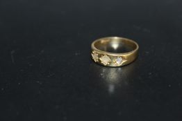 AN 18CT DIAMOND SET RING, the diamonds being low grade and damaged, approx weight 4.2g, ring size