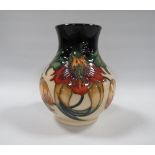A MOORCROFT ANNA LILY PATTERN VASE, of bulbous form, with original price sticker to base covering