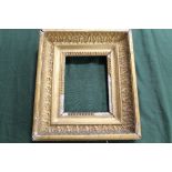 AN 18TH CENTURY GOLD FRAME, with egg and dart design to inner edge and leaf design to outer edge,