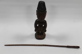 A WEST AFRICAN NIGERIAN MALE YORUBA IGEJI DOLL, with inlaid metal eyes and a West African Baule