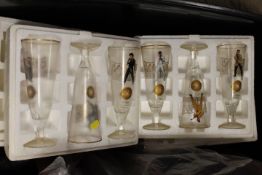 A SET OF ELVIS HIGH BALL GLASSES WITH WOODEN DISPLAY STAND