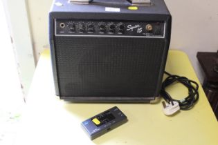 A SMALL SQUIRE 15 AMPLIFIER TOGETHER WITH A HOHNER QUARTZ DIGITAL GUITAR TUNER