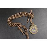 A GENTS ANTIQUE DOUBLE ALBERT POCKET WATCH CHAIN WITH SILVER MEDAL