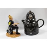 A ROYAL DOULTON FIGURE OF A FIREMAN - MARKED AS A SECOND, TOGETHER WITH A NOVELTY POLICEMAN